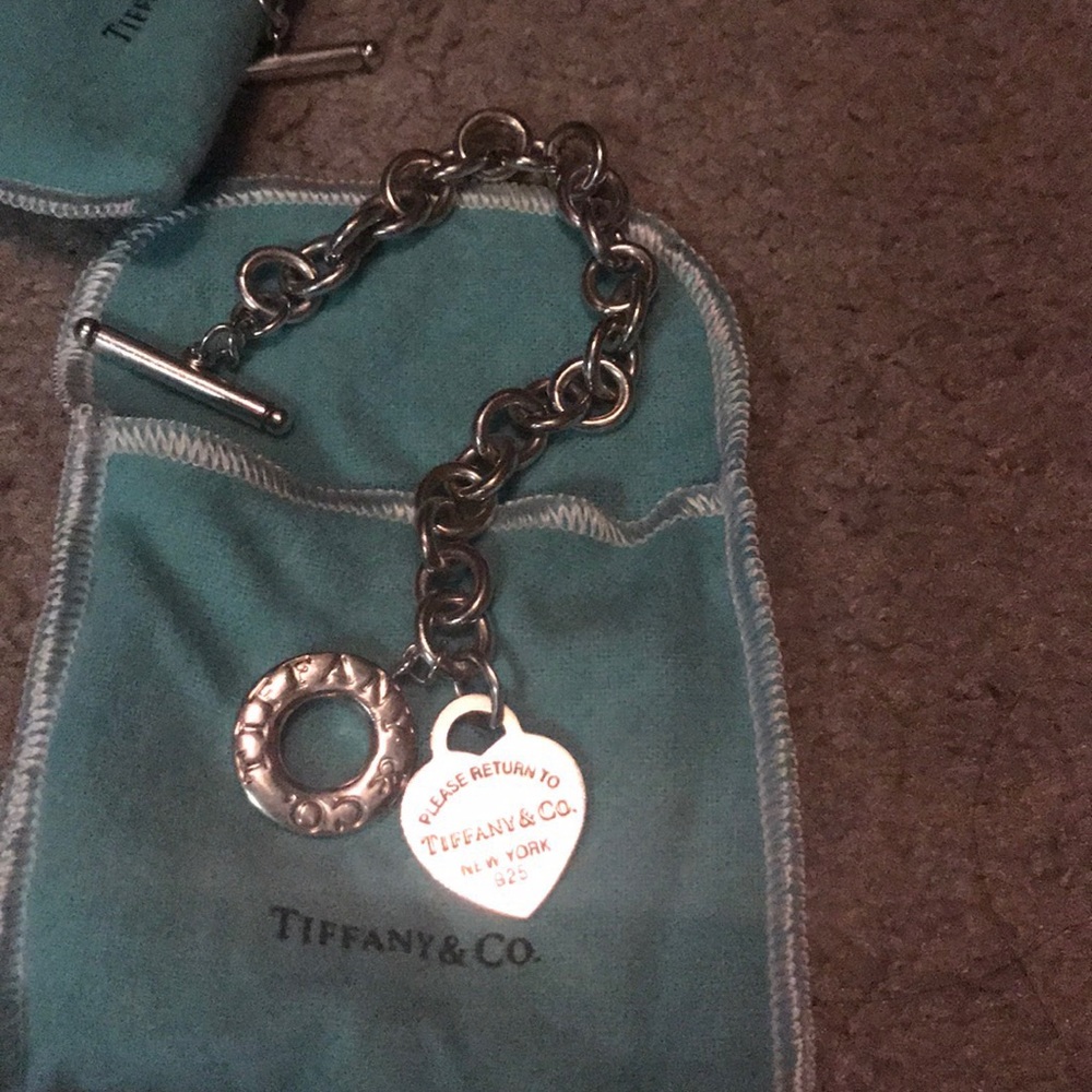 Return to Tiffany and Co. togo charm bracelet.
